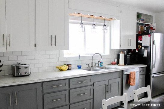 Gray and white painted kitchen cabinets