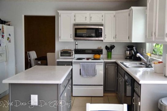 Gray and white painted kitchen cabinets with white countertop