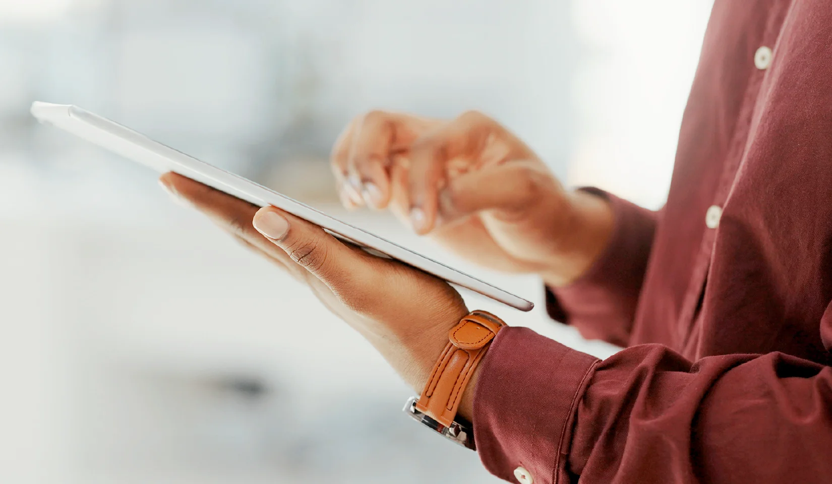 Someone looking over remodeling plans to determine if they need a bathroom remodel permit.