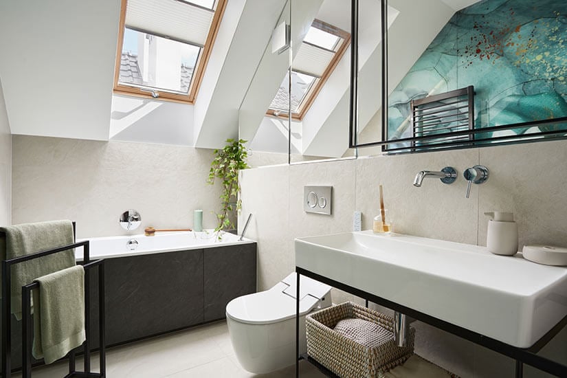 Small bathroom with skylight over bathtub.