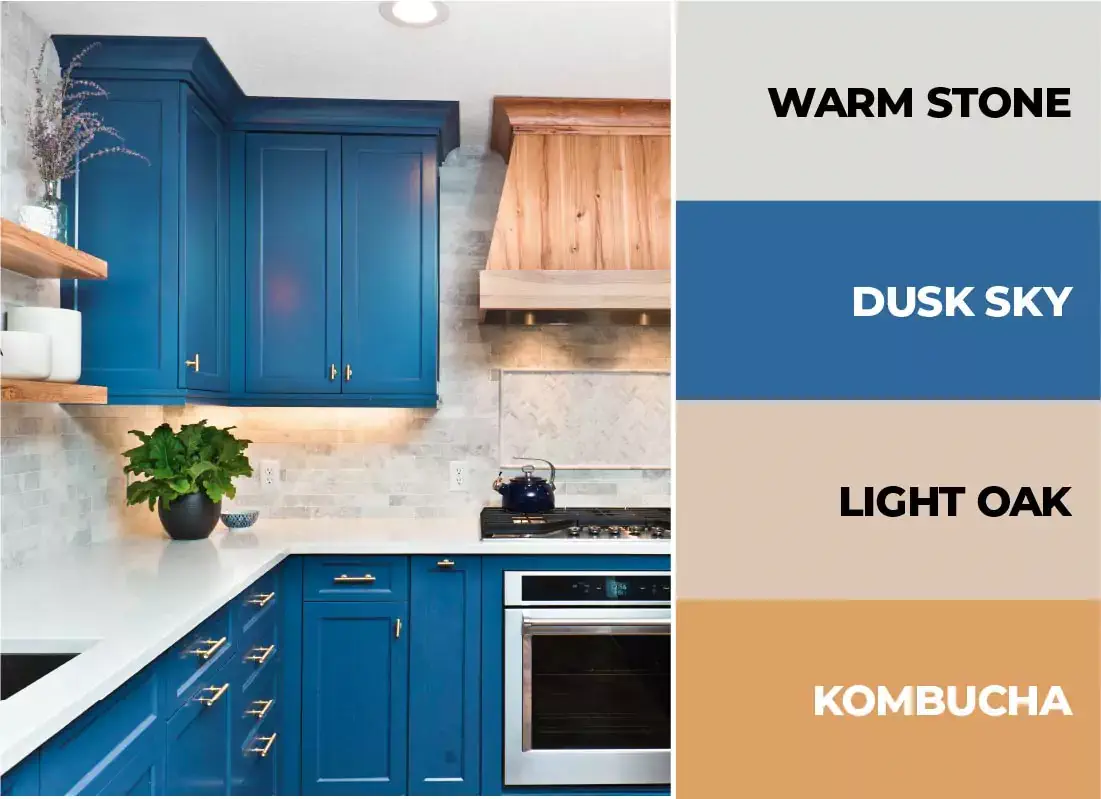 Navy blue kitchen cabinets with neutral accents.