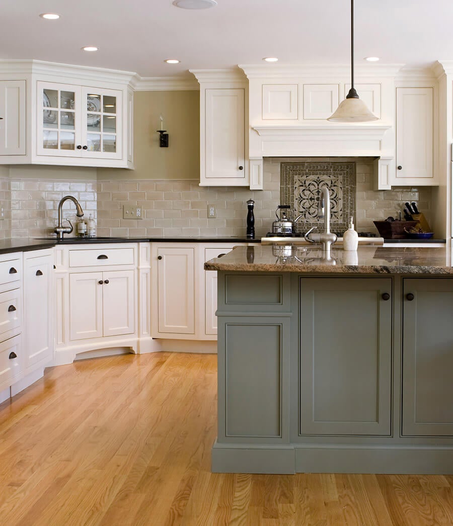 Two tone kitchen cabinets in olive green.