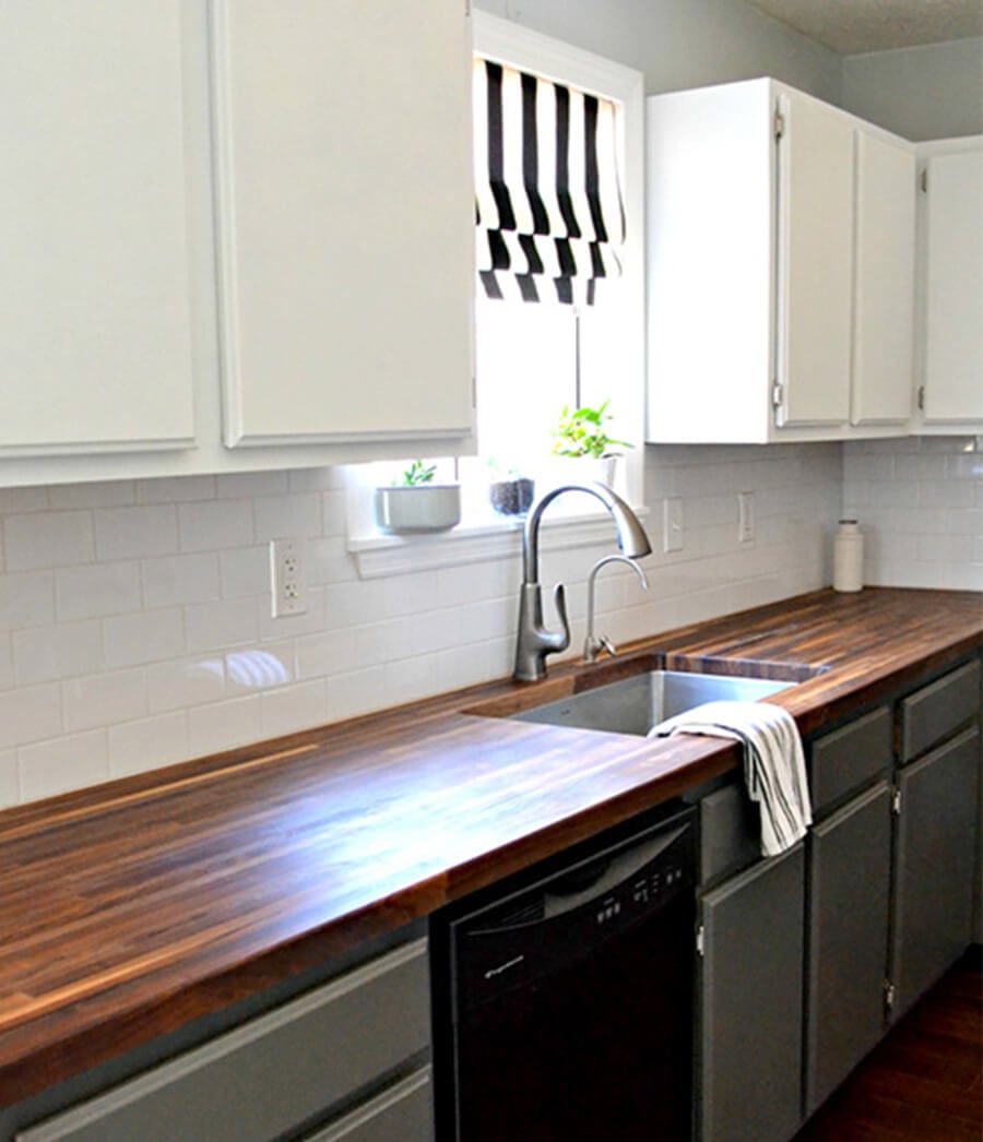 Two tone kitchen cabinet in striped style.