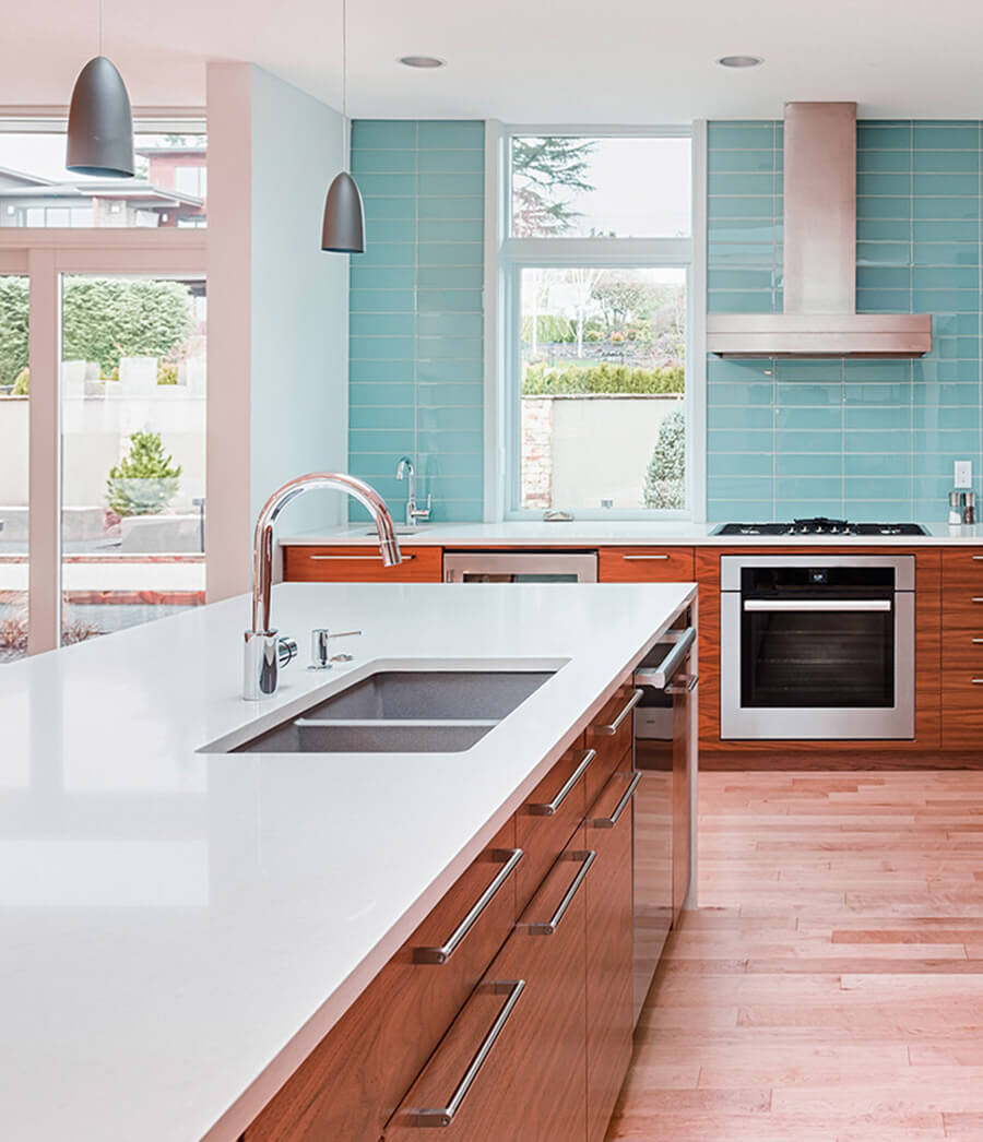 Two-tone kitchen cabinets with bright and grounding tones.