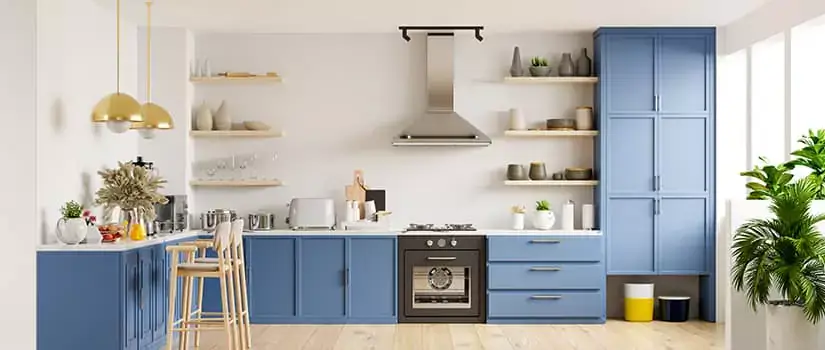 Kitchen with unfinished cabinets painted blue.